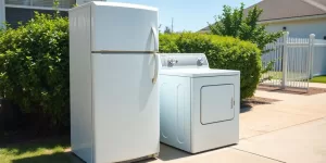 Old refrigerator and washing machine on curb